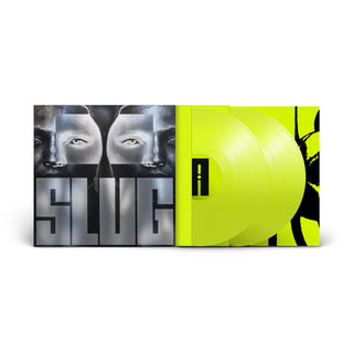A vinyl record album shown open against a white background, with a black-and-gray illustrated cover featuring two faces and the word "SLUG," and two translucent neon yellow records partially visible inside.