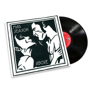 Mad Season - Above vinyl record with its illustrated album cover sleeve, showing a black and white graphic of two figures and a partially visible black vinyl disc with a red center label.